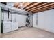 Unfinished basement laundry area featuring washer, dryer, and exposed duct work at 8197 S Fillmore Way, Centennial, CO 80122
