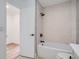 Bright bathroom featuring a shower over tub with glass detail and updated fixtures at 8197 S Fillmore Way, Centennial, CO 80122