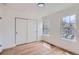 Bedroom with hardwood floors, large windows and a large closet for ample storage at 8197 S Fillmore Way, Centennial, CO 80122