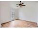 Bright bedroom with hardwood floors, large window, and ample space, providing a peaceful retreat at 8197 S Fillmore Way, Centennial, CO 80122