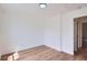Clean bedroom with hardwood flooring and attached door for easy access to other rooms at 8197 S Fillmore Way, Centennial, CO 80122