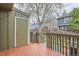 Exterior view of the deck with stained wood and wooden railing, overlooking the neighborhood at 8197 S Fillmore Way, Centennial, CO 80122