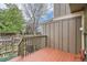 Exterior view of the deck with stained wood and wooden railing, overlooking the yard at 8197 S Fillmore Way, Centennial, CO 80122