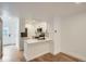 Efficient kitchen with white cabinetry, stone countertops, and stainless steel appliances with an open design at 8197 S Fillmore Way, Centennial, CO 80122