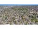 Wide aerial perspective showcasing a residential area with tree-lined streets, houses, and nearby green spaces at 600 E Amherst Ave, Englewood, CO 80113
