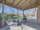 Covered patio with concrete flooring, stylish patio furniture, overhead lighting, and a view of the backyard at 600 E Amherst Ave, Englewood, CO 80113