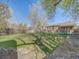 A well maintained and private backyard with mature landscaping, lawn and fence at 600 E Amherst Ave, Englewood, CO 80113
