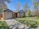 Lovely single-story home with a well-kept lawn, attached garage, and mature trees at 600 E Amherst Ave, Englewood, CO 80113