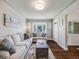 Bright living room with hardwood floors, bay window, and comfortable seating at 600 E Amherst Ave, Englewood, CO 80113