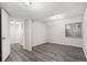 Clean basement space with vinyl floors, white walls, and a well-lit entryway at 2791 S Bahama Ct, Aurora, CO 80013