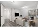 Finished basement with contemporary furnishings, a mounted TV, and an open layout at 2791 S Bahama Ct, Aurora, CO 80013
