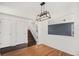 Elegant dining area with stylish light fixture, hardwood floors, and staircase access at 2791 S Bahama Ct, Aurora, CO 80013