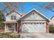 Charming two-story home featuring a brick facade, attached two-car garage, and covered front porch at 2791 S Bahama Ct, Aurora, CO 80013