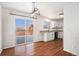 Bright eat-in kitchen featuring granite countertops, stainless appliances, and sliding glass doors to a wood deck at 2791 S Bahama Ct, Aurora, CO 80013