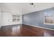 Spacious living room boasts sleek hardwood floors, neutral paint, and plenty of natural light at 2791 S Bahama Ct, Aurora, CO 80013