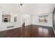 Open concept living room with dark hardwood floors and staircase access at 2791 S Bahama Ct, Aurora, CO 80013