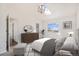 Inviting main bedroom with vaulted ceiling, skylight, modern light fixture, and ensuite bath at 2791 S Bahama Ct, Aurora, CO 80013