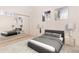 Cozy bedroom featuring neutral decor, a queen-size bed and a mirrored closet at 15475 Andrews Dr # 310, Denver, CO 80239
