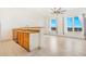 Bright kitchen featuring natural light, stainless steel appliances, and seamlessly connected to the open floor plan at 15475 Andrews Dr # 310, Denver, CO 80239