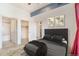 Cozy bedroom with attached bath and walk-in closet, featuring a neutral palette and plush carpeting at 15475 Andrews Dr # 310, Denver, CO 80239