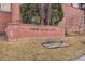 Community signage reading 'Towne Square Lofts' atop a brick retaining wall at 15475 Andrews Dr # 310, Denver, CO 80239