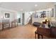 Spacious basement features a wet bar, piano, and carpet flooring at 9667 W Ohio Ave, Lakewood, CO 80226