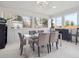Bright and sunny dining room surrounded by windows and contemporary table at 9667 W Ohio Ave, Lakewood, CO 80226