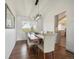 An elegant dining room features hardwood floors and a decorative light fixture at 9667 W Ohio Ave, Lakewood, CO 80226