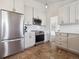 Modern kitchen featuring stainless steel appliances and white cabinets at 9667 W Ohio Ave, Lakewood, CO 80226