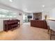 Cozy living room with stone fireplace, wet bar and a large window at 9667 W Ohio Ave, Lakewood, CO 80226