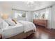 Bright main bedroom featuring wood floors, lots of light, and modern furnishings at 9667 W Ohio Ave, Lakewood, CO 80226