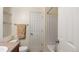 Neutral bathroom with white tiled tub and shower, offering a clean design at 20801 Randolph Pl, Denver, CO 80249