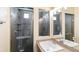 Bathroom boasts a sleek glass shower and stylish vanity with modern fixtures, offering a spa-like experience at 20801 Randolph Pl, Denver, CO 80249