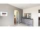 Bedroom with en suite bathroom and dresser, offering a blend of comfort and convenient design at 20801 Randolph Pl, Denver, CO 80249