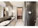 Elegant bathroom with dual vanities, a walk-in shower, and stylish tile at 1901 Wazee St # 1401, Denver, CO 80202