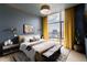 Relaxing bedroom with a cozy bed and stunning city views at 1901 Wazee St # 1401, Denver, CO 80202