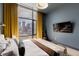 Spacious bedroom with a comfortable bed and city views at 1901 Wazee St # 1401, Denver, CO 80202