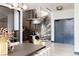 Elegant entryway with a modern spiral staircase and wine storage at 1901 Wazee St # 1401, Denver, CO 80202