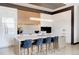 Modern kitchen with white and wood cabinets, large island, and high-end appliances at 1901 Wazee St # 1401, Denver, CO 80202