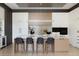 Modern kitchen features a large island with seating and high-end appliances at 1901 Wazee St # 1401, Denver, CO 80202