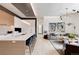 Modern kitchen with white and wood cabinets, large island, and high-end appliances at 1901 Wazee St # 1401, Denver, CO 80202