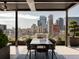 Rooftop patio with dining area and breathtaking city views at 1901 Wazee St # 1401, Denver, CO 80202