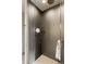 Modern shower with glass enclosure and dark gray tiles at 1901 Wazee St # 1401, Denver, CO 80202