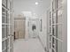 Bright bathroom with white tile floors, glass shower, and skylight at 2717 S Steele St, Denver, CO 80210