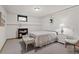 Cozy bedroom featuring neutral carpet, white furniture, and a decorative mirror at 2717 S Steele St, Denver, CO 80210