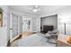 Serene bedroom space showcases french doors leading to connecting rooms, with calming gray and white tones at 2717 S Steele St, Denver, CO 80210