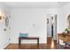 Welcoming entryway with wood floors, bench seating, and vintage decor at 2717 S Steele St, Denver, CO 80210
