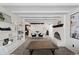 Spacious living room featuring built-in shelves, fireplace, and comfortable seating at 2717 S Steele St, Denver, CO 80210