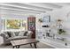 Bright living room with large bay window, built-in shelving, and neutral decor for a relaxing atmosphere at 2717 S Steele St, Denver, CO 80210