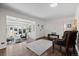 Open living space with hardwood flooring, a bay window, and views to the entryway at 2717 S Steele St, Denver, CO 80210